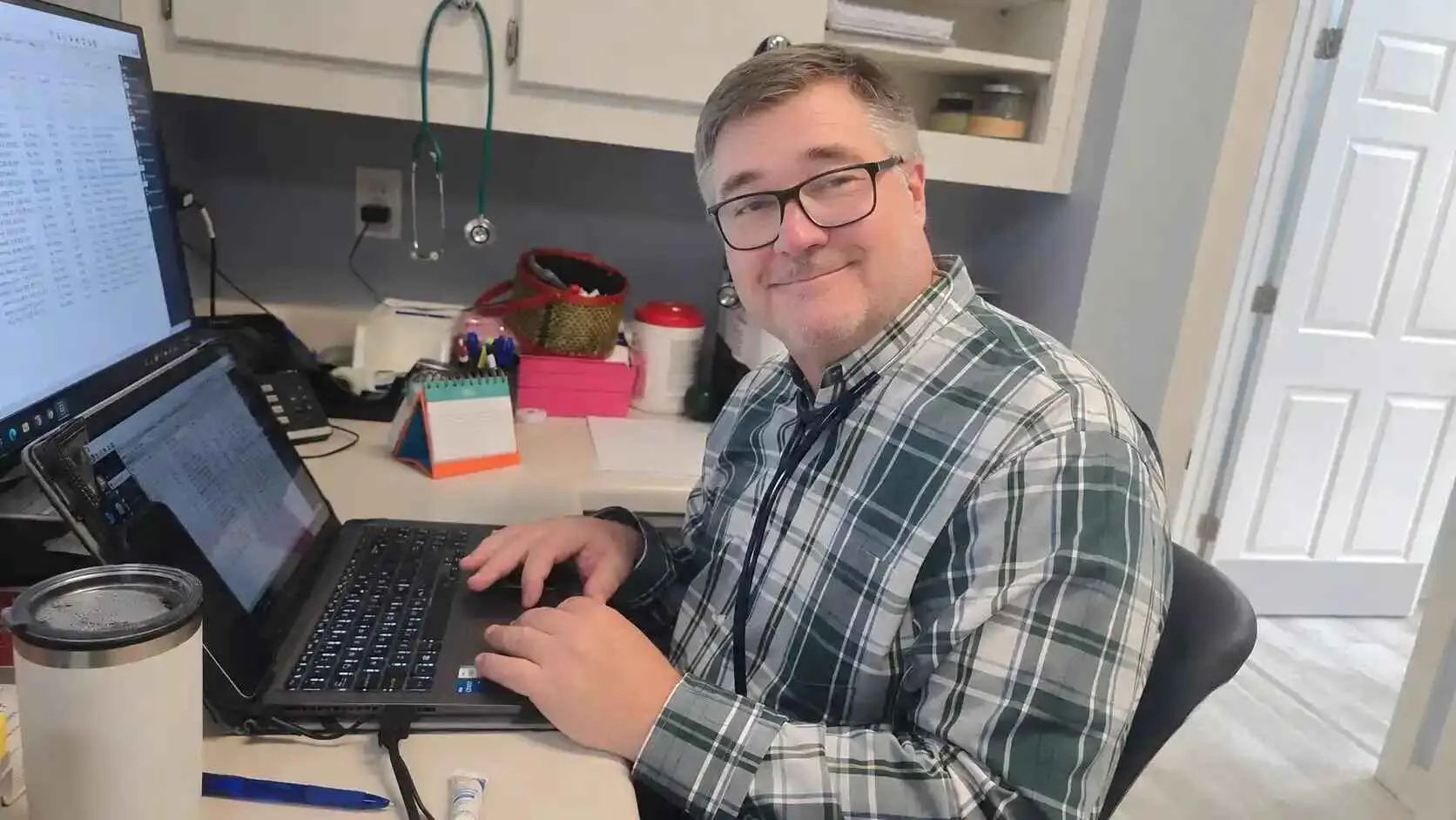 Dr. Keith Morgan at his desk in the Arab office