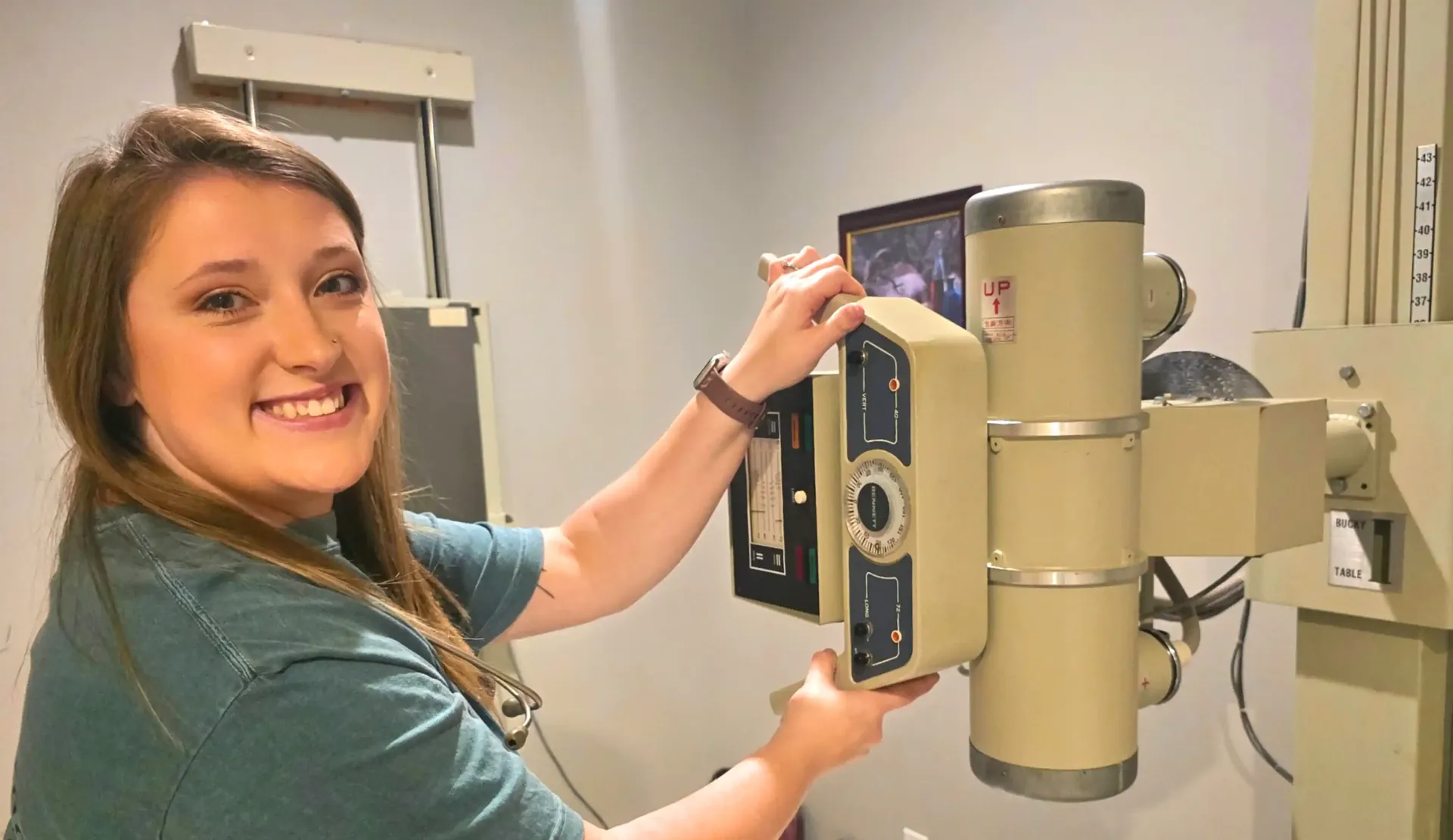 Team member positioning the digital X-ray machine